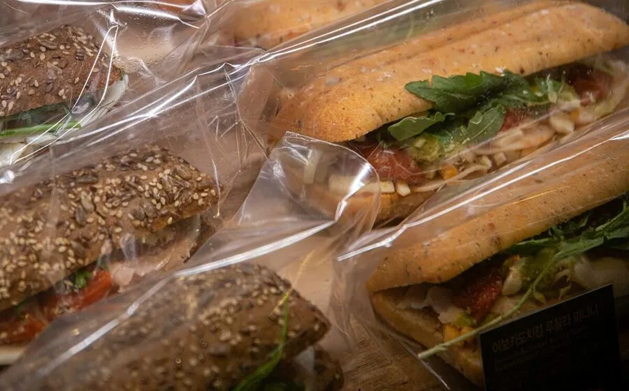 Bagged sandwiches, each one labelled